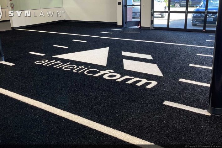 image of SYNLawn Edmonton CA prefab turf logos for athletic weight room applications